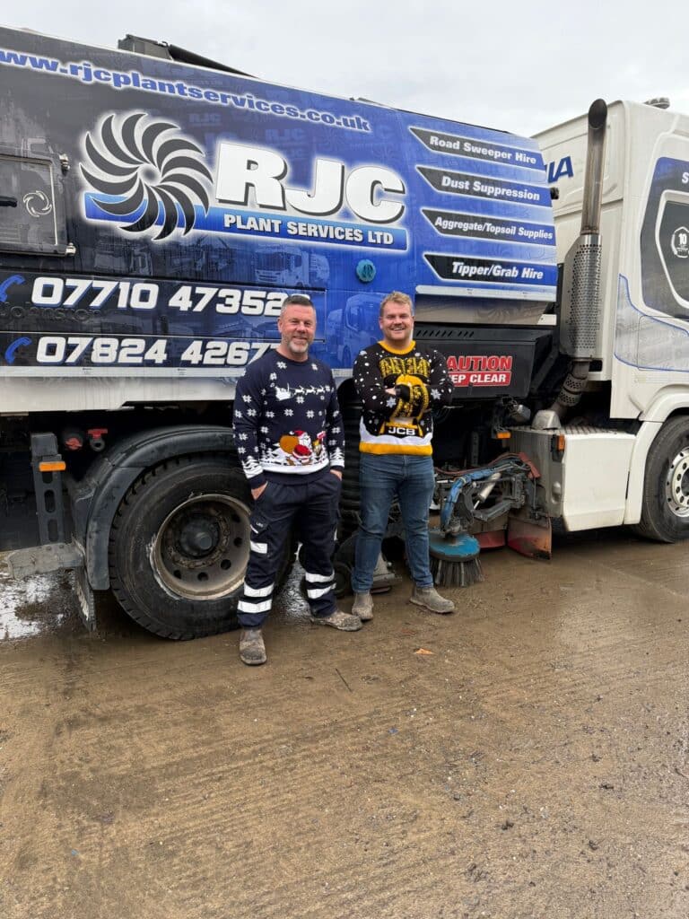 Chris and Sam from RJC in Christmas jumpers
