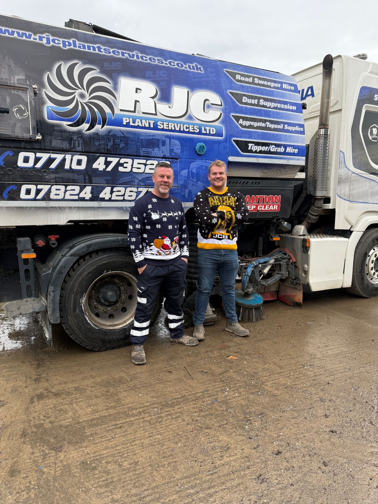 Chris and Sam from RJC in Christmas jumpers