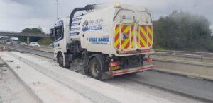 Road sweeper clearing roads