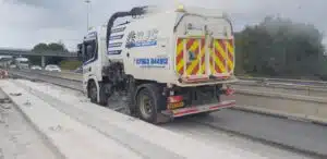 Road sweeper clearing roads