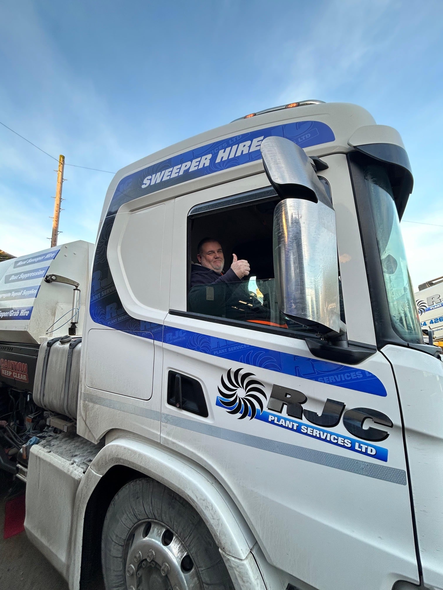 RJC Sweeper Drive giving thumbs up